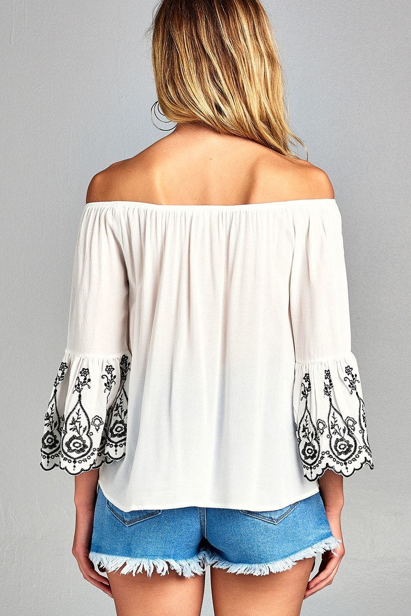 Ladies fashion 3/4 sleeve w/floral embo scallop hem off the shulder woven top