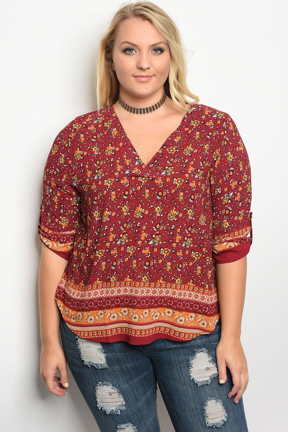 Plus size 3/4 sleeve multi print top with a v neckline