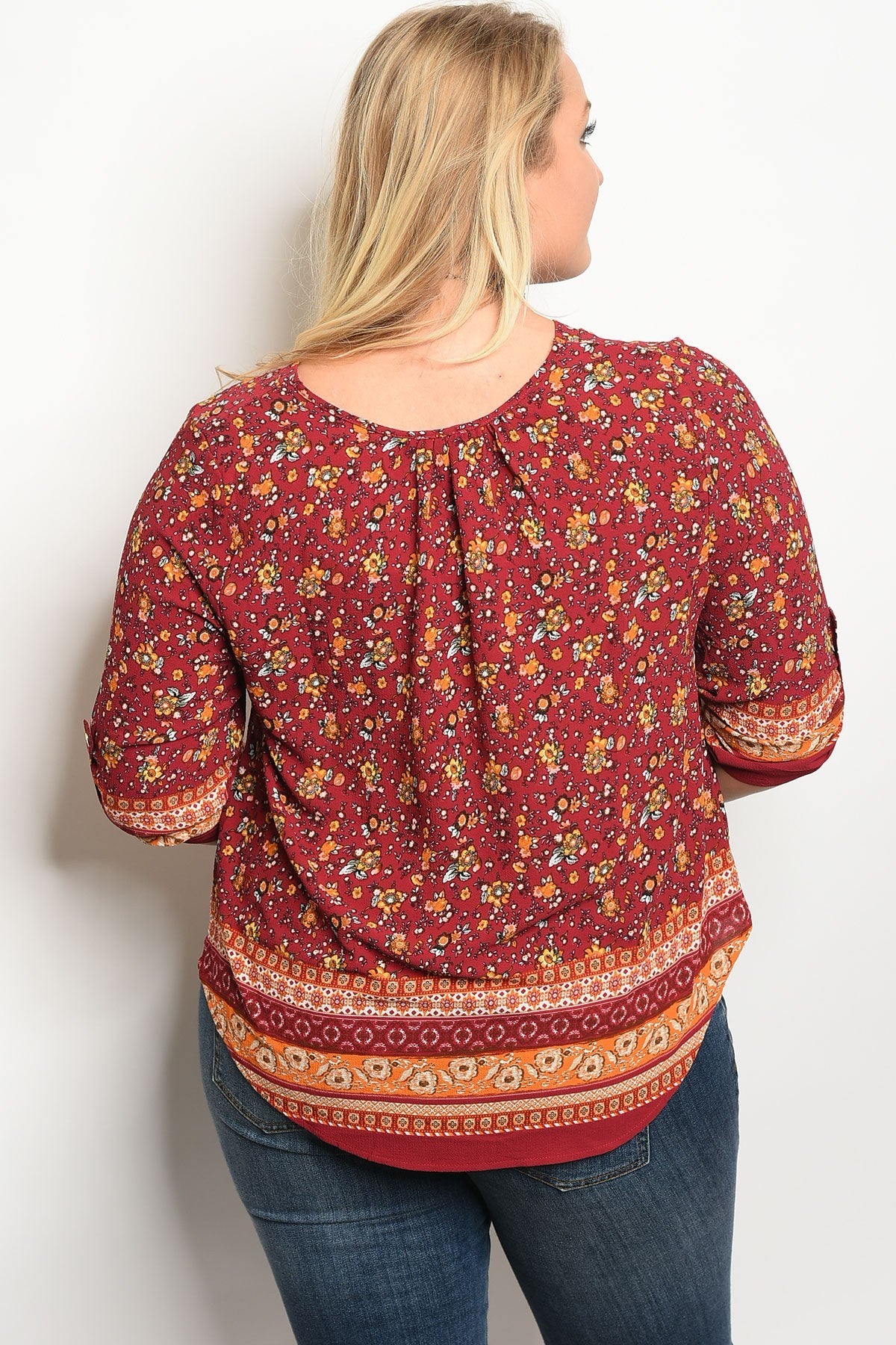 Plus size 3/4 sleeve multi print top with a v neckline