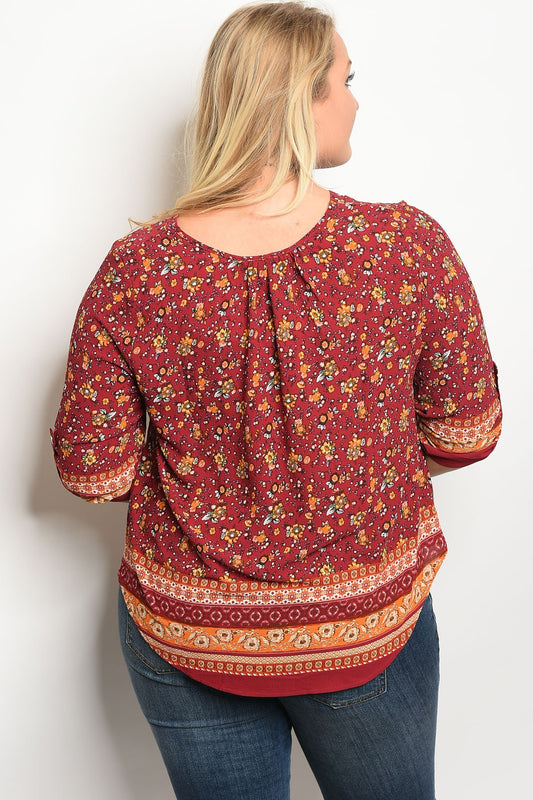 Plus size 3/4 sleeve multi print top with a v neckline