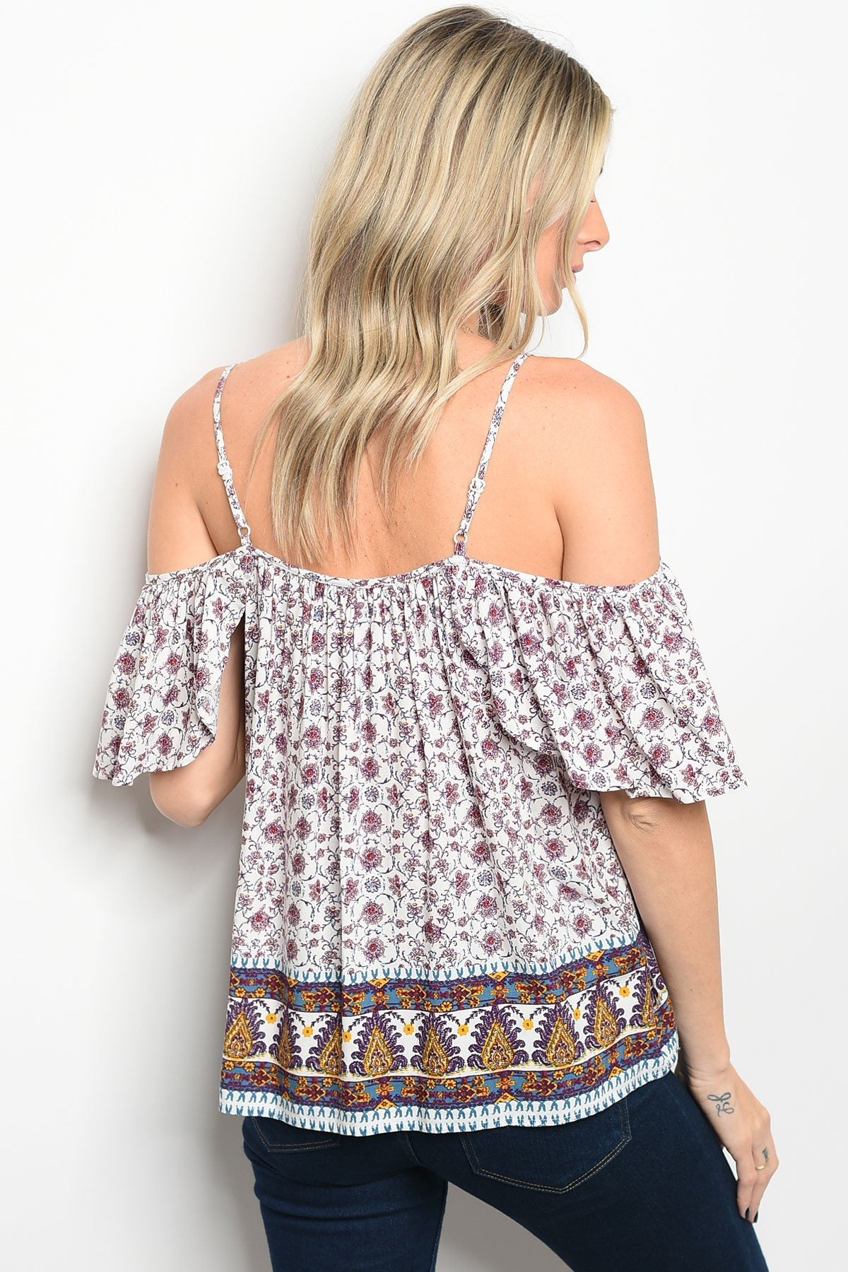 Ladies fashion short sleeve off the shoulder printed top that features a square neckline with a tassel tie