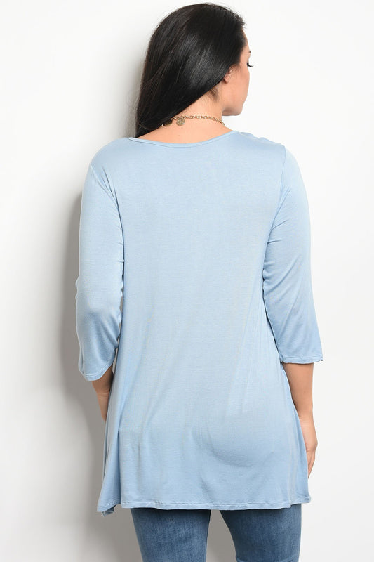 Ladies fashion plus size long sleeve top that features embroidery detail and a rounded neckline