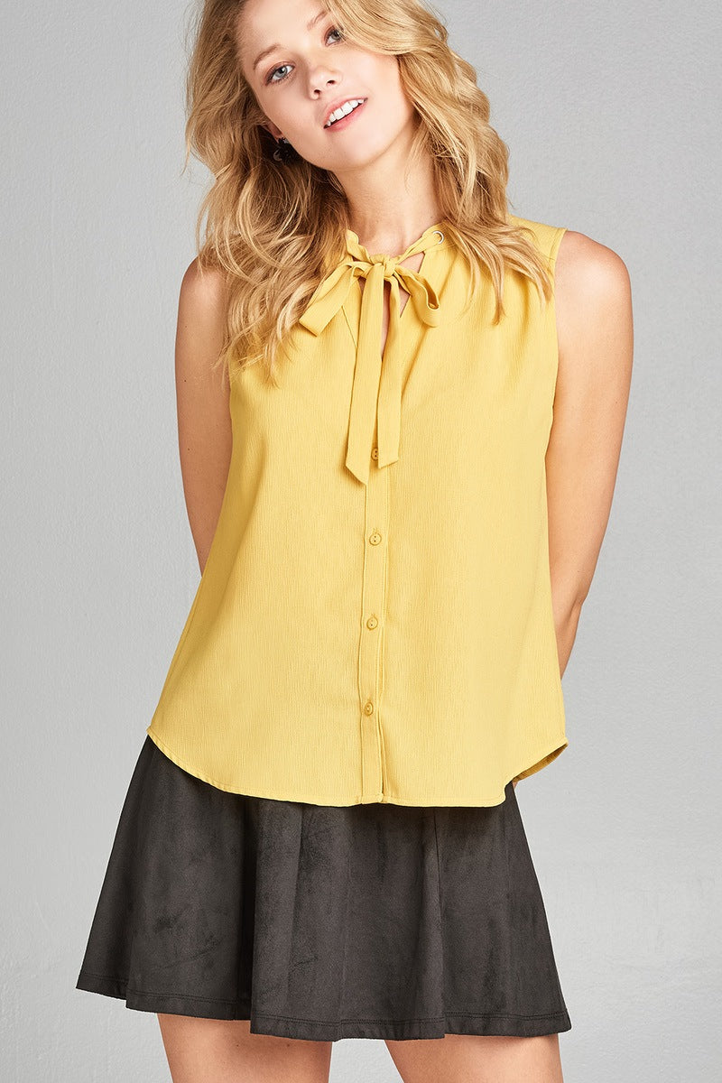 Ladies fashion sleeveless v-neck self tie w/eyelet detail front button woven top