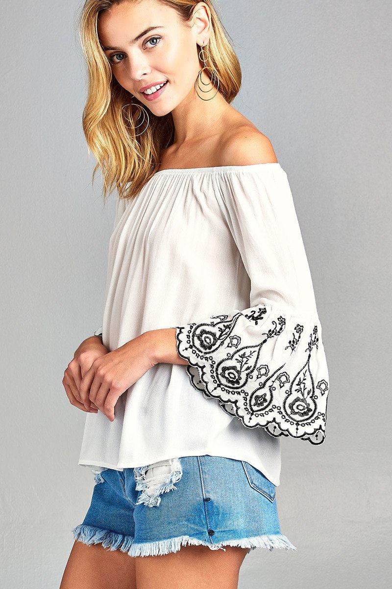 Ladies fashion 3/4 sleeve w/floral embo scallop hem off the shulder woven top