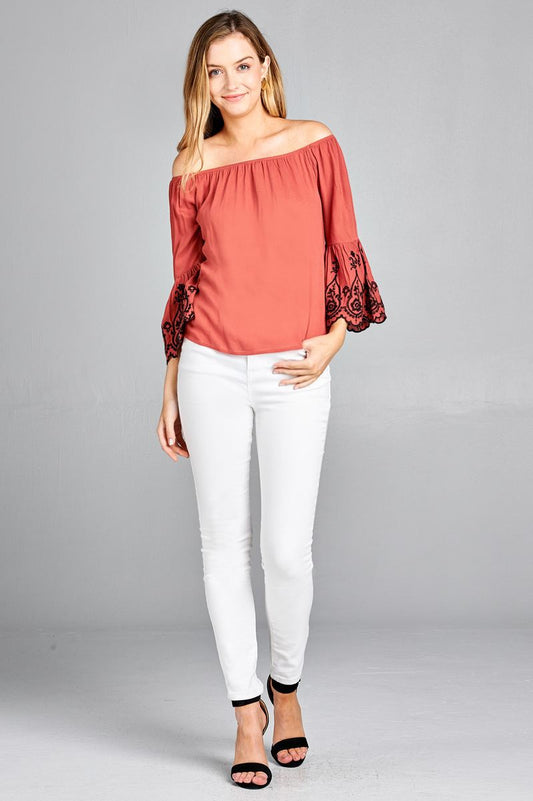Ladies fashion 3/4 sleeve w/floral embo scallop hem off the shulder woven top