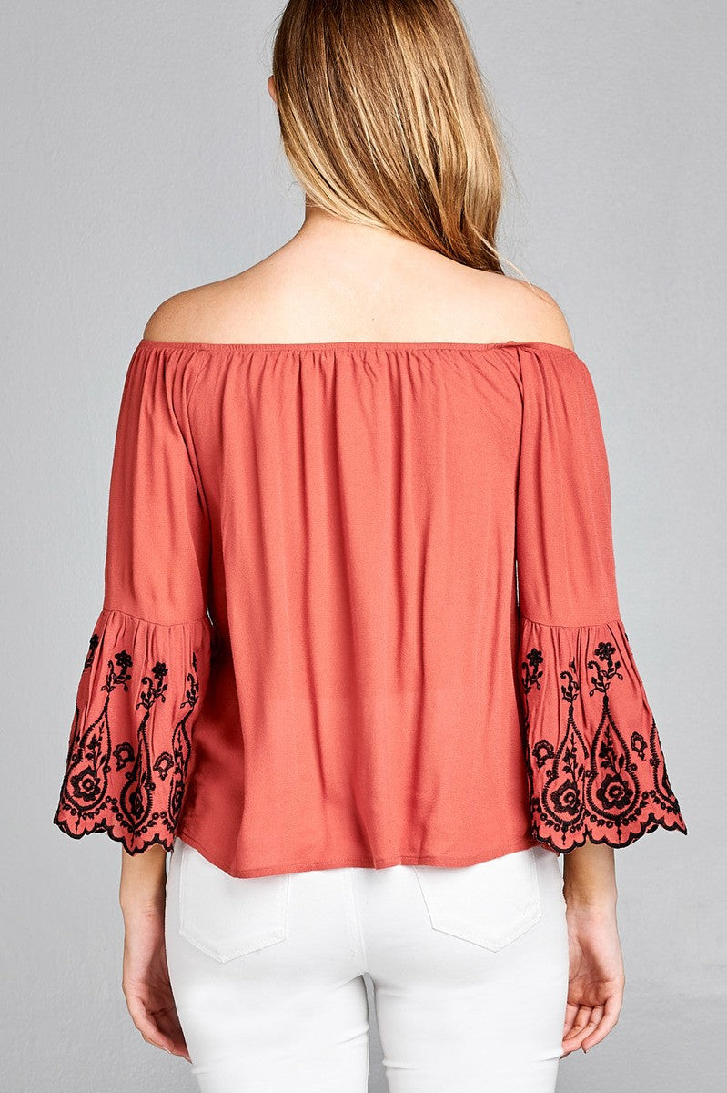 Ladies fashion 3/4 sleeve w/floral embo scallop hem off the shulder woven top
