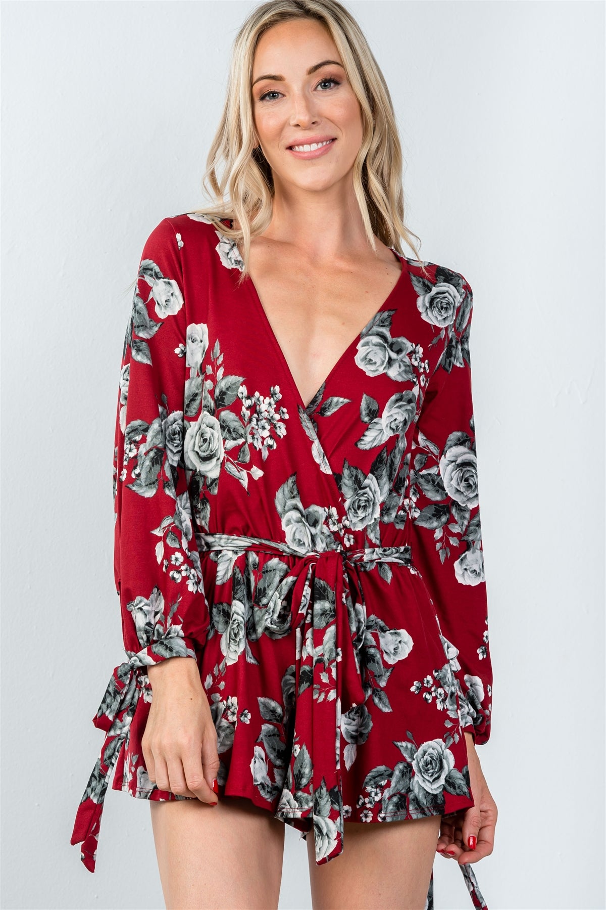 Ladies fashion plunging v-neckline tie long sleeve waist tie floral romper