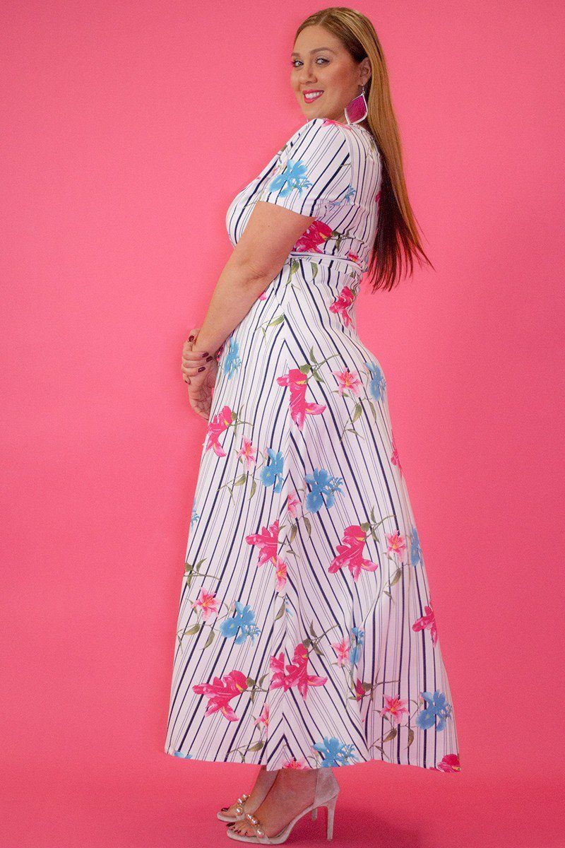 Striped Floral Print Maxi Dress In A Relaxed Fit And Flare Style With A Wrapped V-neck, Short Sleeves, Side Pockets And Waist Tie Belt