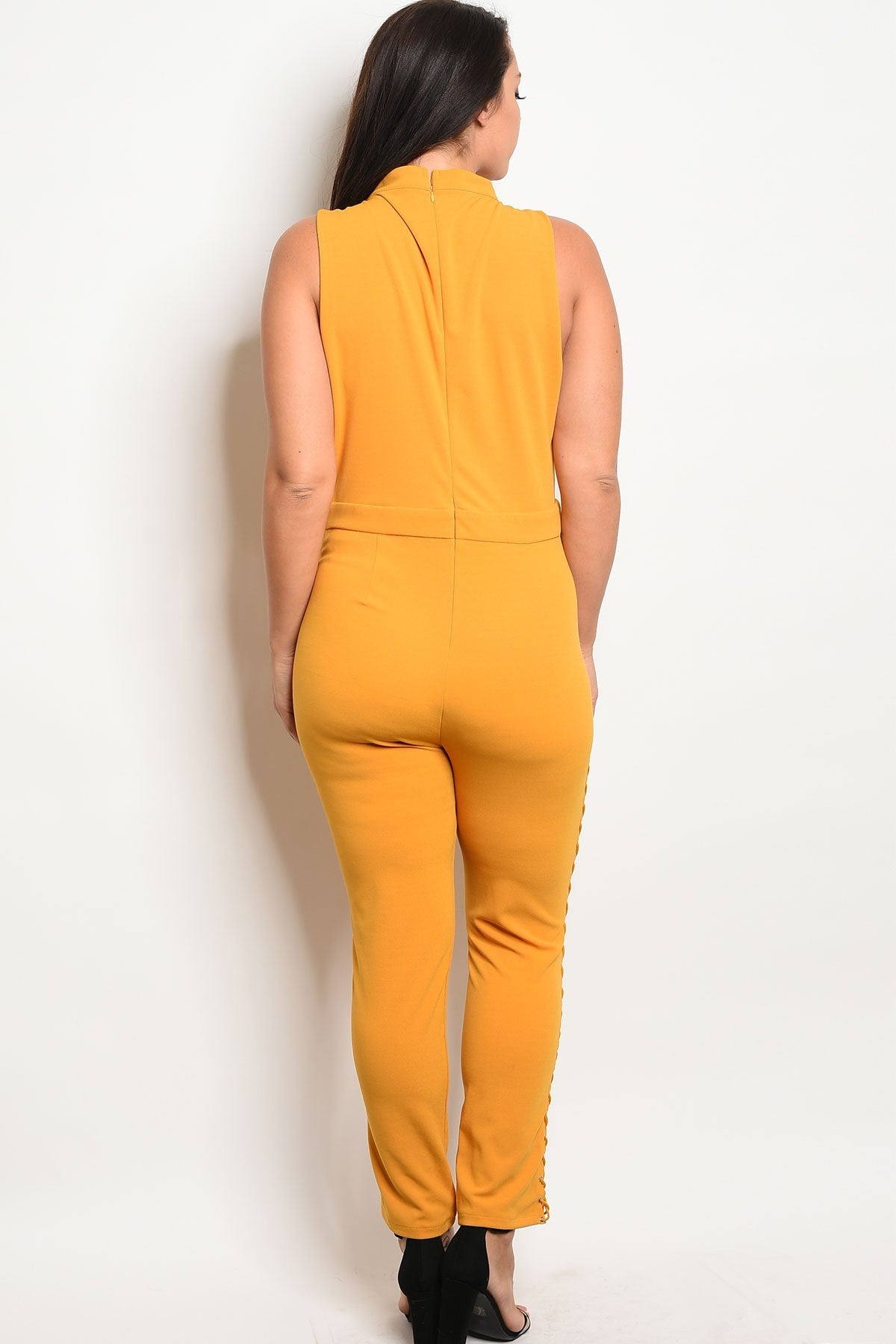 Ladies fashion sleeveless fitted jumpsuit with a mock neckline and lace up details